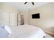 Bright and airy bedroom with a ceiling fan, ensuite bathroom and spacious closet at 815 Paden St, Woodstock, GA 30188