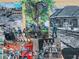 Brick mural depicting local historical scenes, adding a touch of community character to the area at 815 Paden St, Woodstock, GA 30188