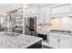 Well-appointed kitchen featuring granite countertops and stainless steel appliances at 815 Paden St, Woodstock, GA 30188