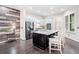 Modern kitchen featuring stainless steel appliances, white cabinetry, and a granite island at 815 Paden St, Woodstock, GA 30188