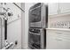 Efficient laundry area with stacked washer/dryer units and modern organizers at 815 Paden St, Woodstock, GA 30188