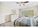 Cozy main bedroom with tray ceiling, modern ceiling fan, large windows, and designer bed at 815 Paden St, Woodstock, GA 30188