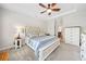 Spacious main bedroom featuring tray ceiling, modern ceiling fan, and designer bed at 815 Paden St, Woodstock, GA 30188