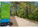 Scenic view of the Noonday Creek Trail, with its paved path and surrounding greenery at 815 Paden St, Woodstock, GA 30188