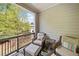 Comfortable covered patio with outdoor seating with a view of nature at 815 Paden St, Woodstock, GA 30188