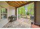 Covered patio with outdoor grill, brick pavers, and view of the backyard at 815 Paden St, Woodstock, GA 30188