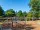 Image of climbing structure at the playground with green canopy and a bridge to another play structure at 815 Paden St, Woodstock, GA 30188