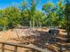 Image of climbing structure at the playground with green canopy and a tunnel to another play structure at 815 Paden St, Woodstock, GA 30188