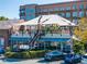 Exterior of Pure Taqueria restaurant featuring covered outdoor dining area and street parking at 815 Paden St, Woodstock, GA 30188