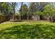 Well maintained lawn with stepping stones and tall privacy fence, complete with storage shed at 136 Flora Ne Ave, Atlanta, GA 30307