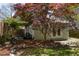 Backyard studio features stone patio and manicured landscape in a private backyard at 136 Flora Ne Ave, Atlanta, GA 30307