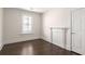 Bedroom featuring a large window, hardwood floors and decorative mantel at 136 Flora Ne Ave, Atlanta, GA 30307
