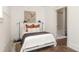 Bedroom featuring a bed, stylish decor, and an ensuite bathroom with modern fixtures at 136 Flora Ne Ave, Atlanta, GA 30307