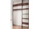 This closet features exposed white brick and custom wood shelving, creating ample and stylish storage space at 136 Flora Ne Ave, Atlanta, GA 30307