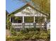 Charming home with a welcoming front porch framed by lush landscaping in a desirable location at 136 Flora Ne Ave, Atlanta, GA 30307