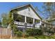 Charming home with a welcoming front porch framed by lush landscaping in a desirable location at 136 Flora Ne Ave, Atlanta, GA 30307