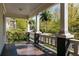 Inviting front porch with ferns and detailed trim, offering a cozy outdoor space at 136 Flora Ne Ave, Atlanta, GA 30307