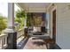 Inviting front porch with swing and decorative accents, offering a cozy outdoor space at 136 Flora Ne Ave, Atlanta, GA 30307