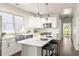 Bright, modern kitchen with stainless steel appliances, center island, and ample counter space at 136 Flora Ne Ave, Atlanta, GA 30307