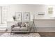 Bright living room area showcasing a cozy sofa, decor, and climate control at 136 Flora Ne Ave, Atlanta, GA 30307