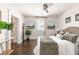 Calm main bedroom with hardwood floors, neutral bedding, and lots of natural light at 136 Flora Ne Ave, Atlanta, GA 30307