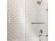 Close up of walk-in shower featuring white subway tile and glass door at 136 Flora Ne Ave, Atlanta, GA 30307