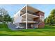 Modern two-story home with balconies and an attached three-car garage at 1484 N Druid Hills Ne Rd, Brookhaven, GA 30319
