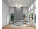 Bright main bedroom featuring modern tray ceiling with chandelier and large windows at 1484 N Druid Hills Ne Rd, Brookhaven, GA 30319