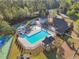 Aerial view of swimming pool, tennis courts, playground, clubhouse and basketball court offer something for everyone at 1754 Water Springs Way, Dacula, GA 30019