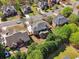 Aerial view of the home and neighborhood showing a mix of residential properties and lush greenery at 1754 Water Springs Way, Dacula, GA 30019