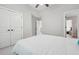 Bright bedroom featuring a large bed and closet space with double doors at 1754 Water Springs Way, Dacula, GA 30019