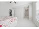 Bedroom featuring vaulted ceiling, ceiling fan, and ensuite bathroom at 1754 Water Springs Way, Dacula, GA 30019