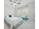 Cozy bedroom featuring a ceiling fan and window seat with bench overlooking backyard at 1754 Water Springs Way, Dacula, GA 30019