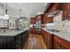 Spacious kitchen featuring custom cabinets, granite countertops, and modern appliances at 1754 Water Springs Way, Dacula, GA 30019