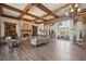 Spacious living room features wood floors, wood beams, fireplace and plenty of room to enjoy with friends and Gathering at 1754 Water Springs Way, Dacula, GA 30019