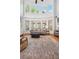 Elegant living room boasts high ceilings, large windows and an area rug at 1754 Water Springs Way, Dacula, GA 30019
