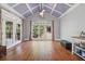Inviting sitting room features large windows, vaulted ceiling, and access to the porch at 1754 Water Springs Way, Dacula, GA 30019