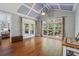 Inviting sitting room with lots of light, vaulted ceiling, and access to the porch at 1754 Water Springs Way, Dacula, GA 30019
