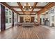 Spacious lobby with hardwood floors, coffered ceilings, fireplace, and elegant furnishings, designed for relaxation at 1754 Water Springs Way, Dacula, GA 30019