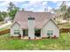 Back view of home with open porch, well-kept yard, and inviting outdoor space for relaxing and entertaining at 505 Bryson Lake Cir, Douglasville, GA 30134