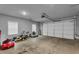 Spacious three car garage with bright lighting and ample storage at 505 Bryson Lake Cir, Douglasville, GA 30134