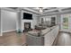 Spacious living room features a fireplace and large sectional couch, perfect for relaxation and entertainment at 505 Bryson Lake Cir, Douglasville, GA 30134