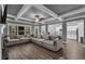 Bright open-concept living room connected to a kitchen and dining area, featuring modern design elements at 505 Bryson Lake Cir, Douglasville, GA 30134