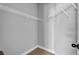 Spacious walk-in closet with white wire shelving and neutral carpeting provides ample storage space at 505 Bryson Lake Cir, Douglasville, GA 30134