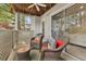 Relaxing balcony with wicker chairs, perfect for enjoying the outdoors, and the peaceful view from the bedroom at 6820 Glenridge Dr # C, Sandy Springs, GA 30328