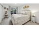 Cozy bedroom features neutral tones, decorative wall art, balcony access, and a unique bookshelf design at 6820 Glenridge Dr # C, Sandy Springs, GA 30328