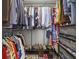 Walk-in closet with ample hanging space, shelving and storage for shoes at 6820 Glenridge Dr # C, Sandy Springs, GA 30328