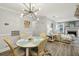 Open concept dining room with view into a comfortable living room area at 6820 Glenridge Dr # C, Sandy Springs, GA 30328