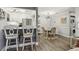 Open concept dining room featuring modern lighting, and nearby kitchen and laundry at 6820 Glenridge Dr # C, Sandy Springs, GA 30328