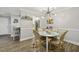 Cozy dining room with modern lighting, seating for four, and bright colors at 6820 Glenridge Dr # C, Sandy Springs, GA 30328